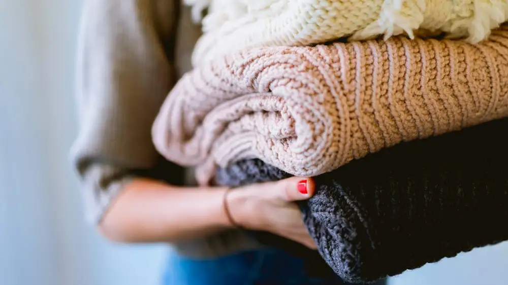 A laundry setup that fits in a bathroom corner
