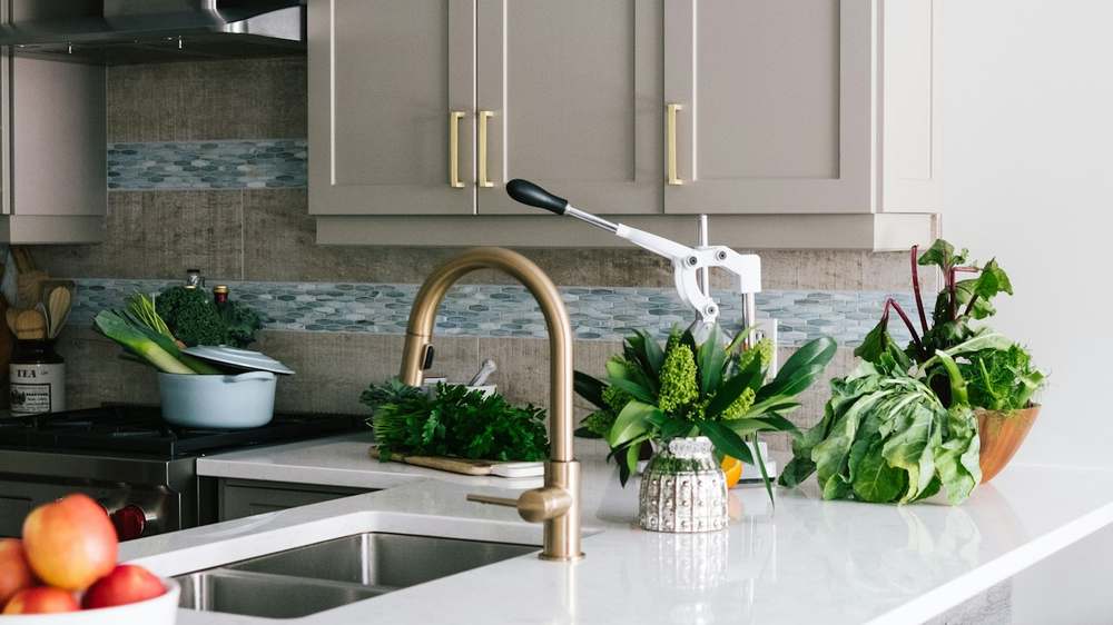 A compact kitchen where vertical storage and clear counters work together